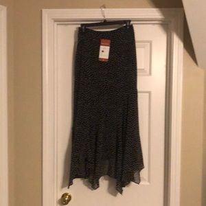 Black skirt white dots, Size 2. Handkerchief hem, long with slight flair.